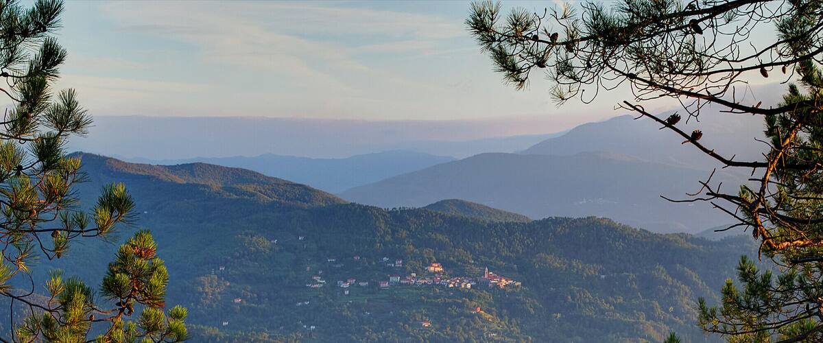 A mountainous landscape with a small village nestled among the hills.