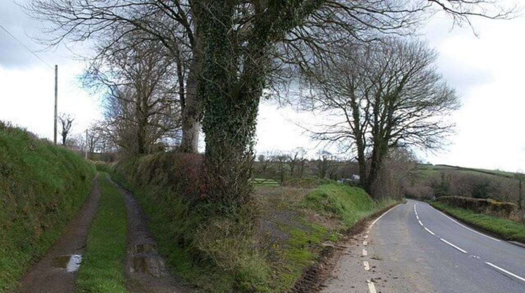 Track and road, Worden Cross. The A388 swings away to cross Fishpool Lake at Horrellsford, while the track on the left crosses it a little further north. Across the road on the right is 740930.