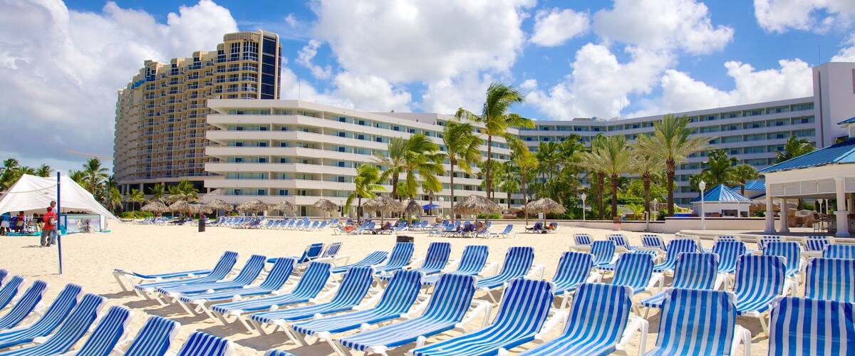 Bãi biển Cable trong đó bao gồm bãi biển cát, khách sạn sang trọng hoặc resort và quang cảnh miền nhiệt đới