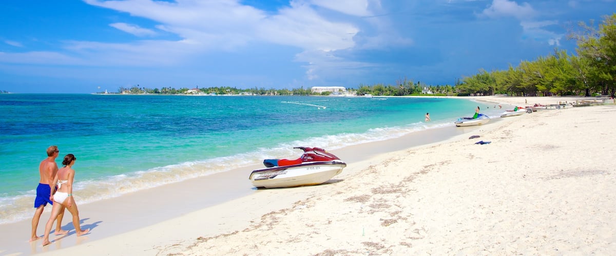 Cable Beach showing jet skiing, a beach and tropical scenes
