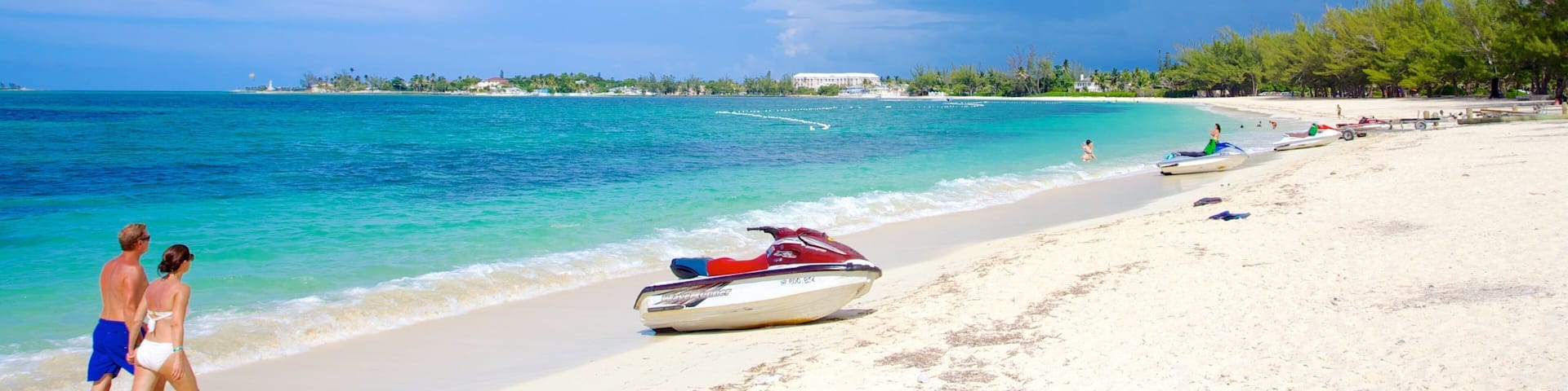 Cable Beach featuring a sandy beach, tropical scenes and jet skiing