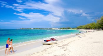 Cable Beach featuring a sandy beach, tropical scenes and jet skiing