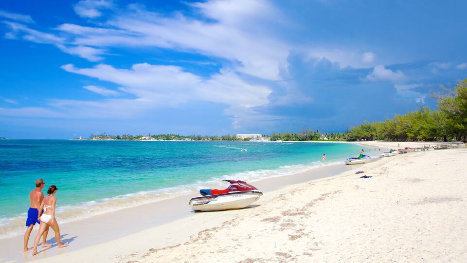 Cable Beach featuring a sandy beach, tropical scenes and jet skiing
