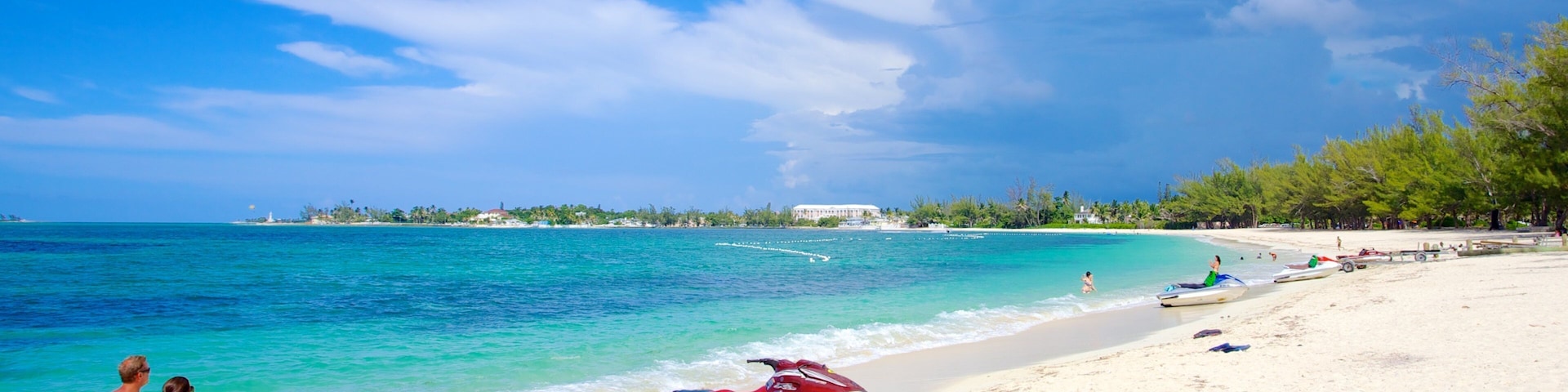 Cable Beach featuring a sandy beach, tropical scenes and jet skiing