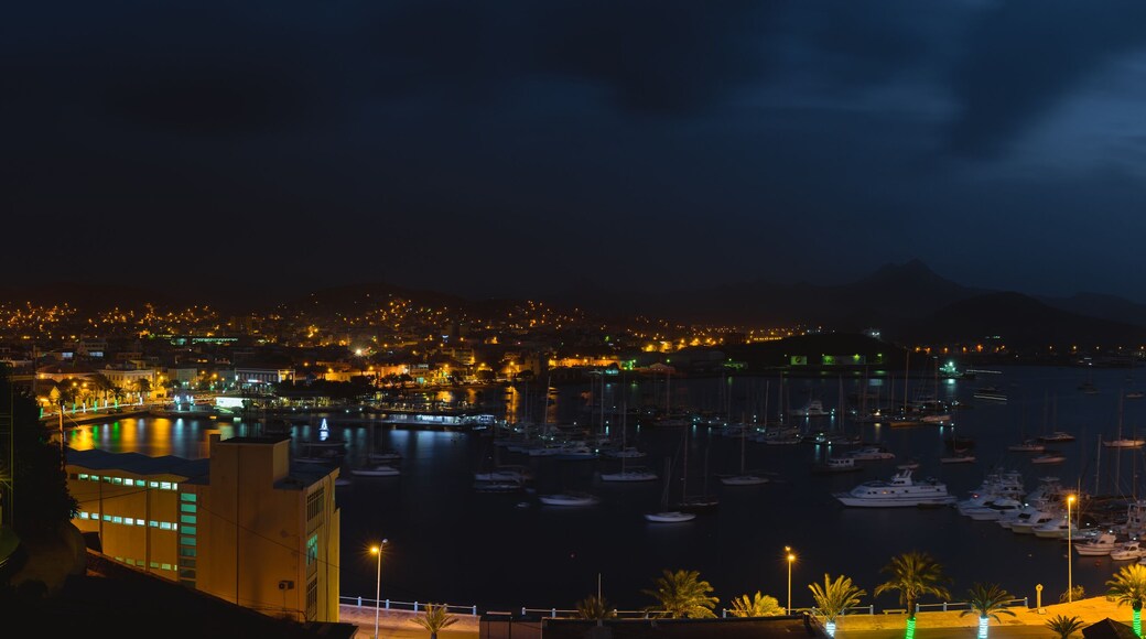 Mindelo in dusk light. Port town with many boats in the bay on the Cape Verde in the northern part of the island Sao Vicente. Long exposure panoramic shot of the bay