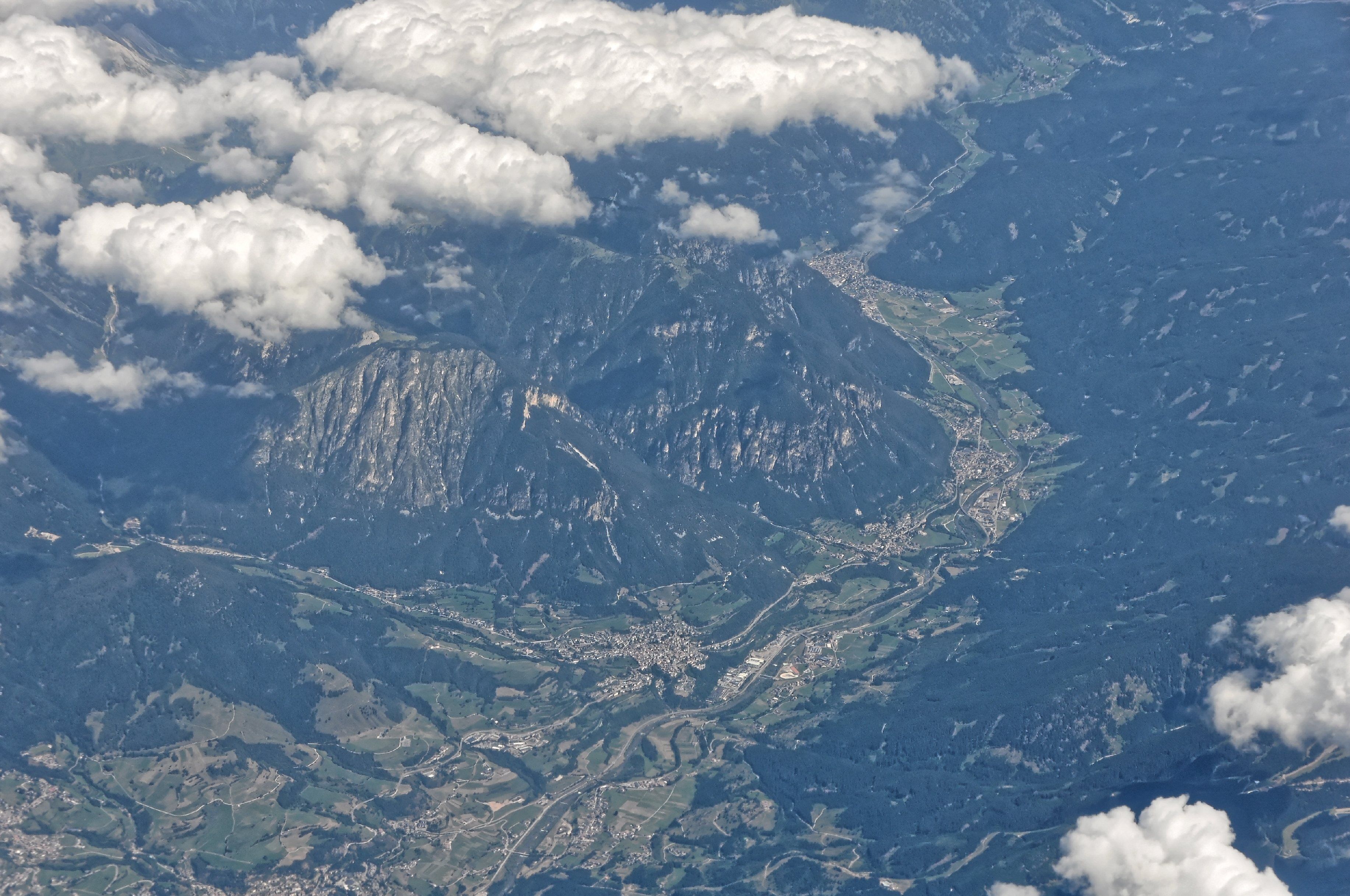 A mountainous landscape with a town nestled in a valley.