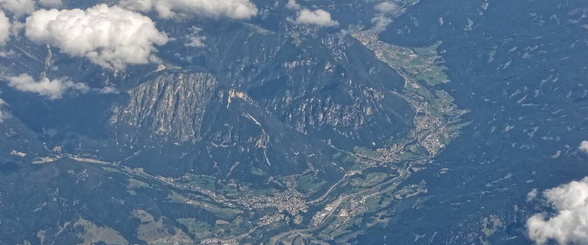 A mountainous landscape with a town nestled in a valley.