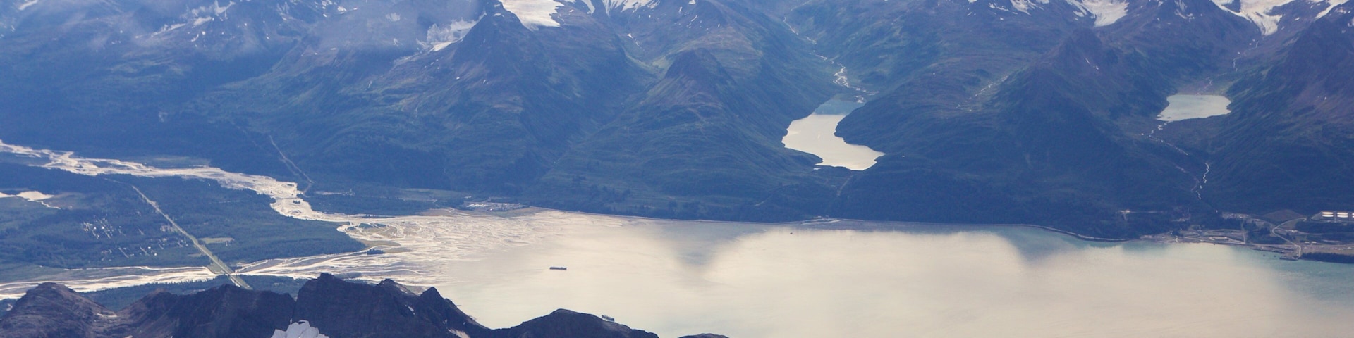 Chugach State Park showing mountains, a river or creek and snow