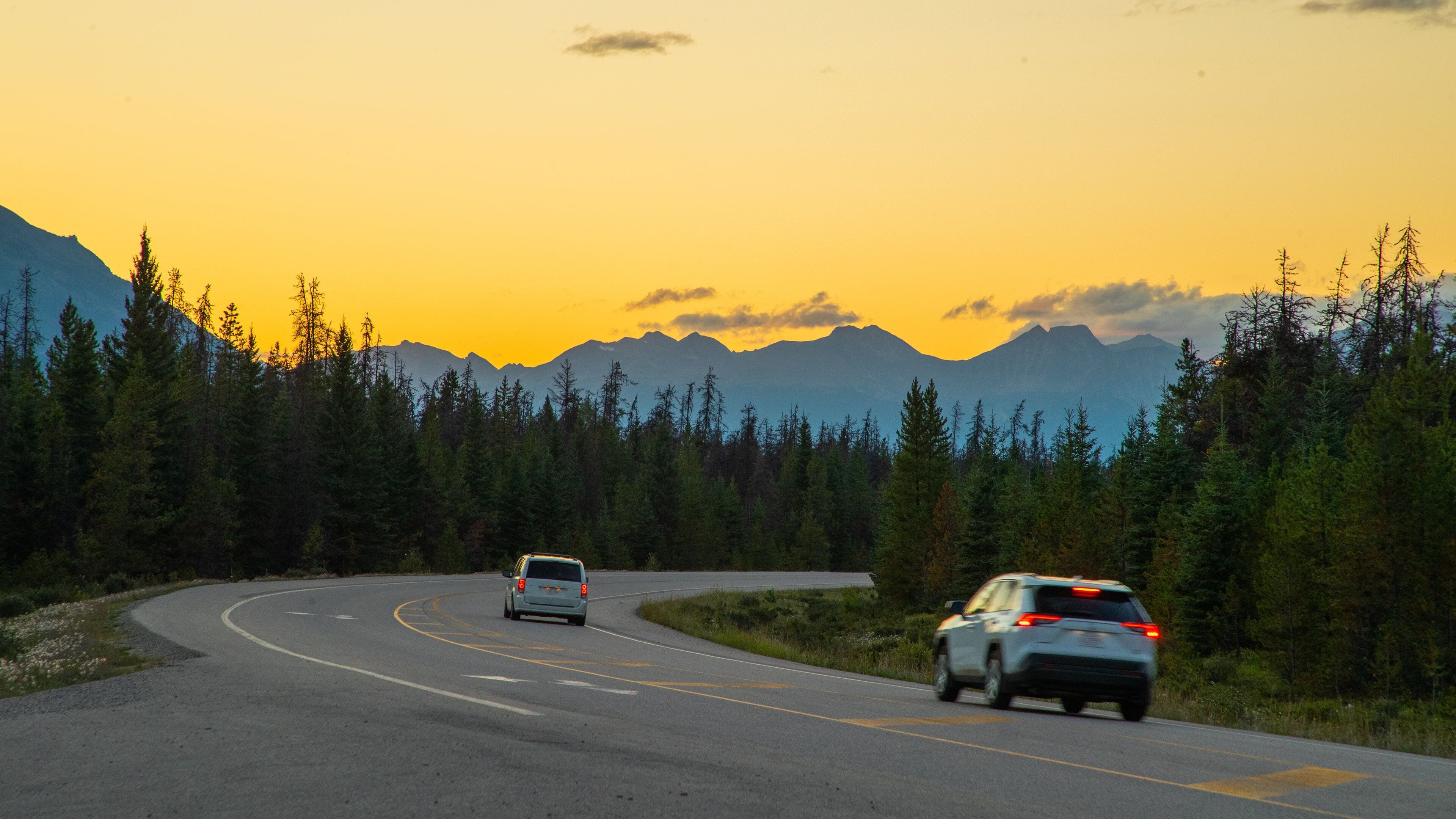 Icefields Parkway featuring tranquil scenes and a sunset