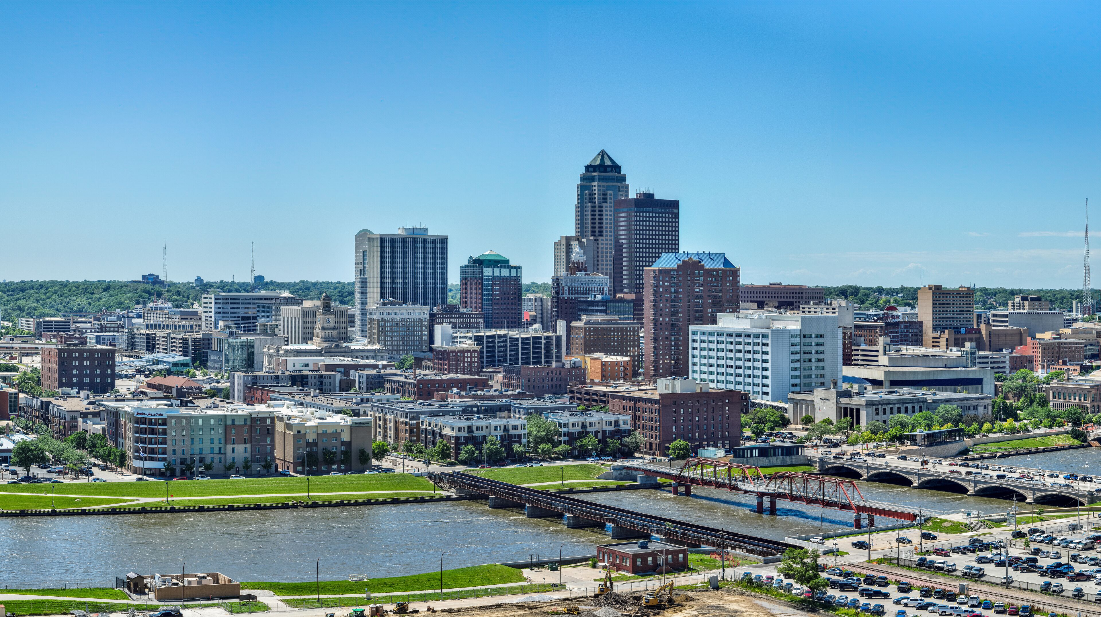 A city skyline with a prominent river and a bridge.