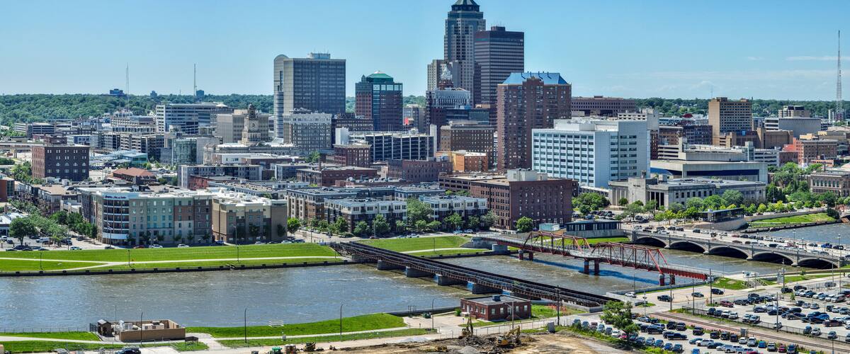 A city skyline with a prominent river and a bridge.