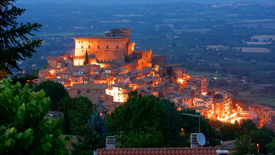 Soriano nel Cimino featuring heritage architecture, night scenes and a city