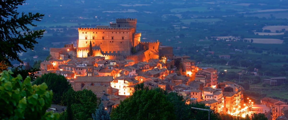 A historic town with a prominent castle and surrounding buildings.