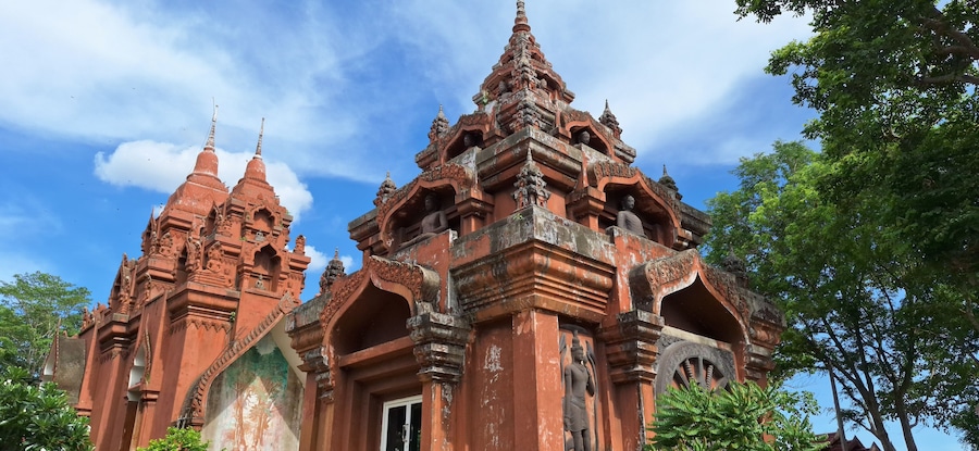 Wat Khao Angkhan 7 May 2025 The architecture of Wat Khao Angkhan with blue sky with clouds is located in Chaloem Phra Kiat District, Buriram Province, Thailand.