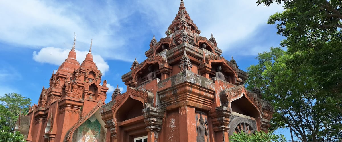 Wat Khao Angkhan 7 May 2025 The architecture of Wat Khao Angkhan with blue sky with clouds is located in Chaloem Phra Kiat District, Buriram Province, Thailand.