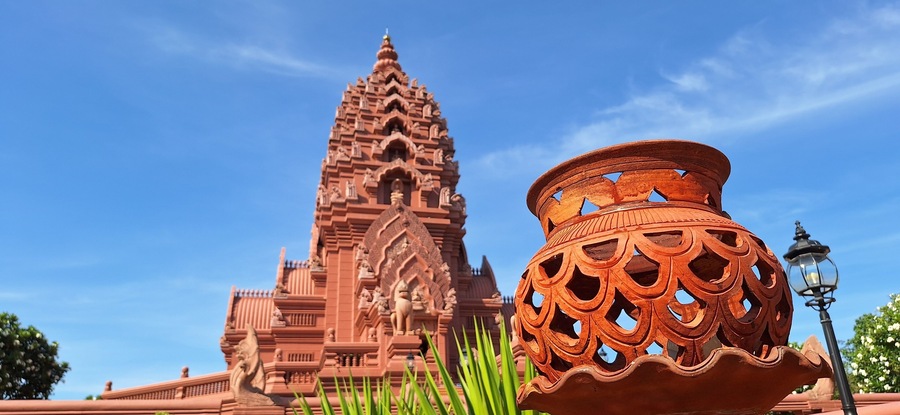 The architecture of Wat Khao Angkhan with blue sky with clouds is located in Buriram Province, Thailand.