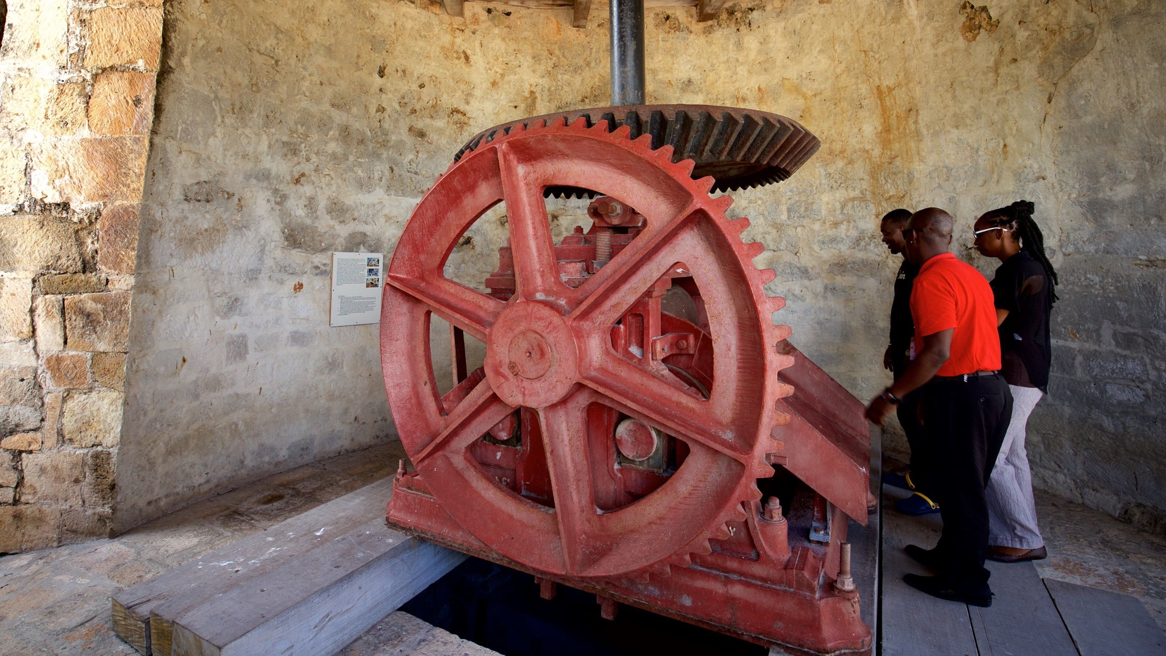 Betty\'s Hope Sugar Plantation featuring interior views and heritage elements as well as a small group of people