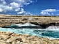 A natural bridge out of rocks across the Caribbean Sea. Beautiful! But attention! You might get wet...