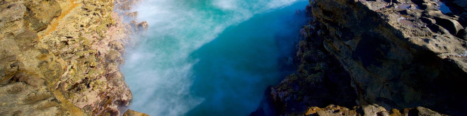 Devil\'s Bridge featuring waves, rugged coastline and general coastal views