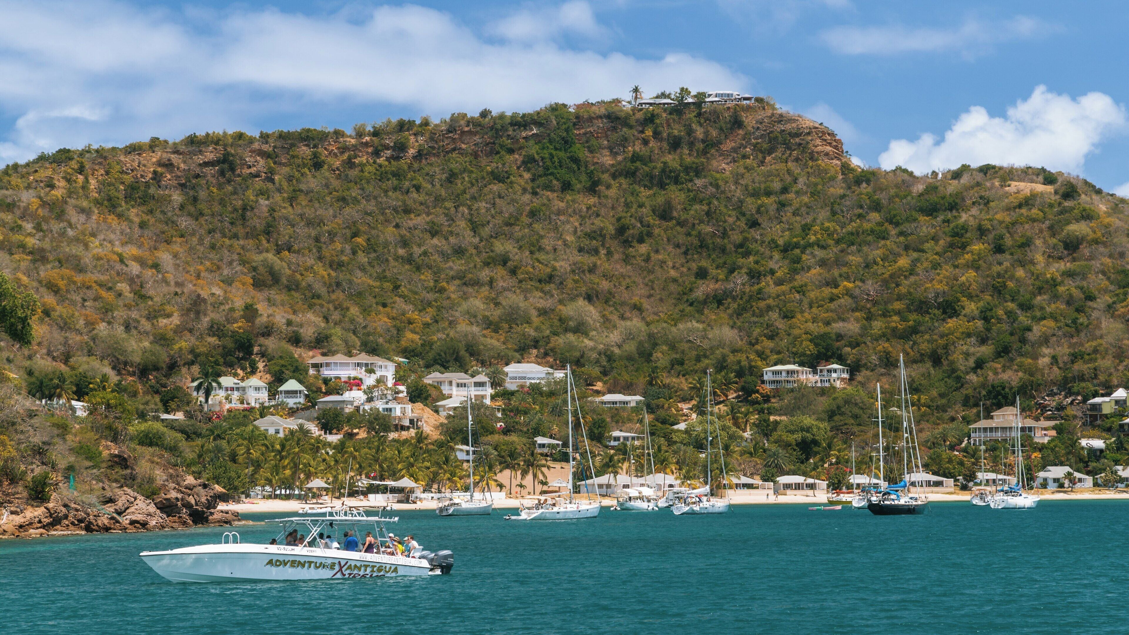 Exploration of Nelson's Dockyard at English Harbour in Antigua and Barbuda with boats and lush hills in view