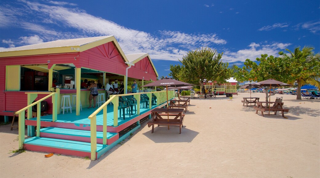 Valley Church Beach showing a sandy beach and general coastal views as well as a small group of people