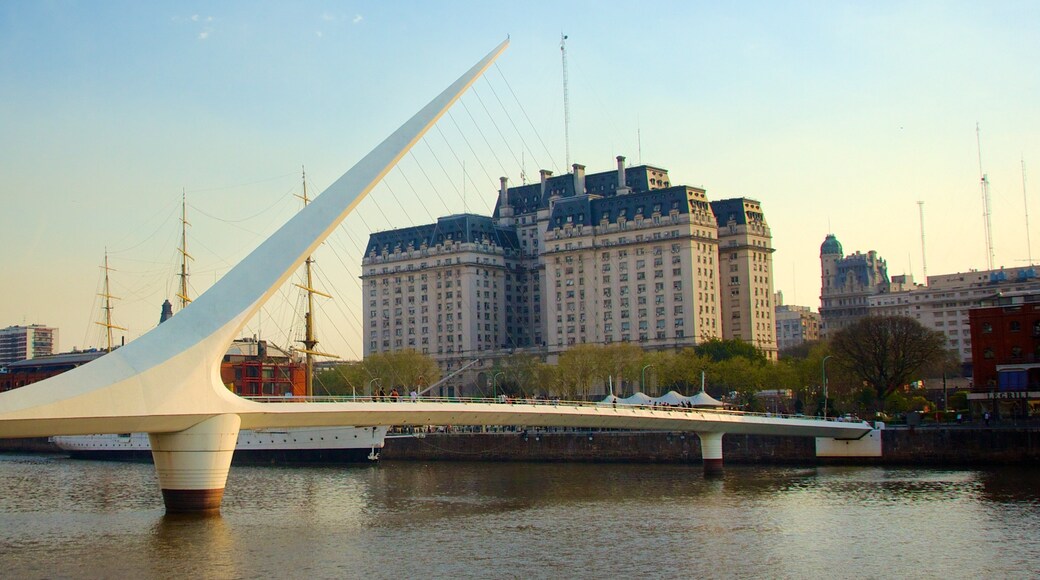 Women\'s Bridge showing a river or creek, a bridge and modern architecture