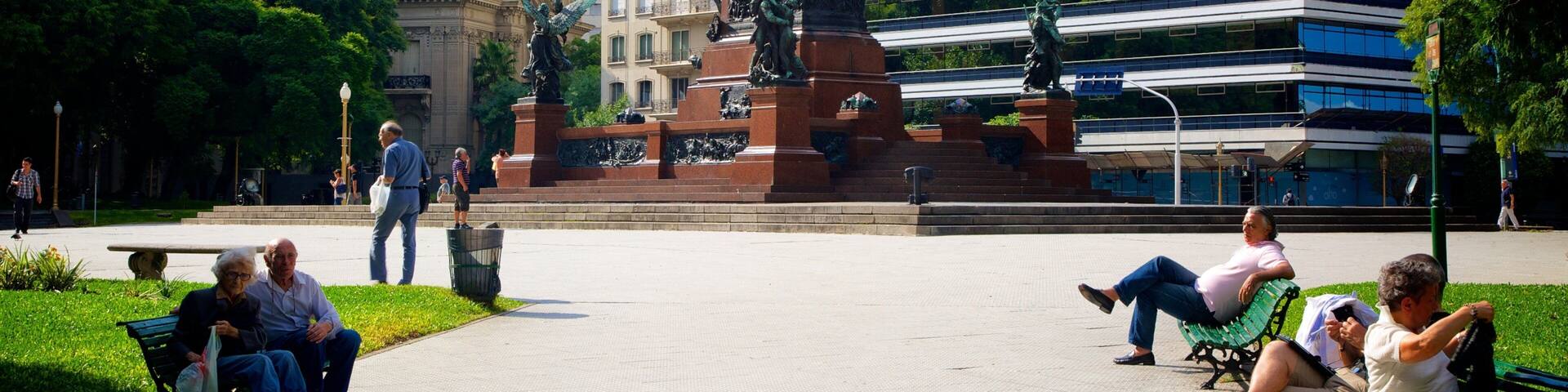 Plaza San Martin which includes a square or plaza, a statue or sculpture and a city