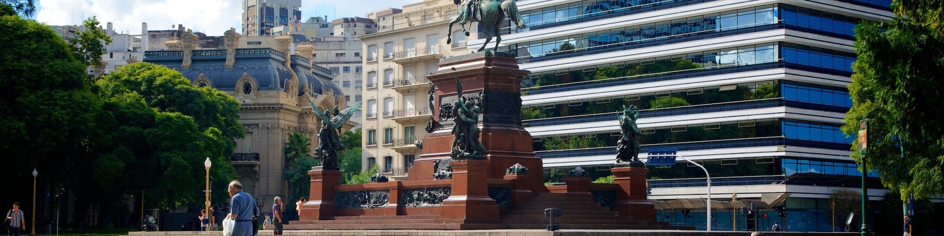 Plaza San Martin which includes a square or plaza, a statue or sculpture and a city