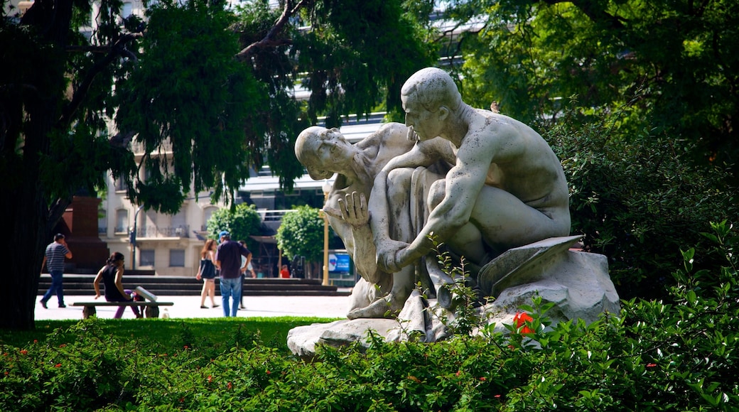 Plaza San Martin featuring a garden and a statue or sculpture