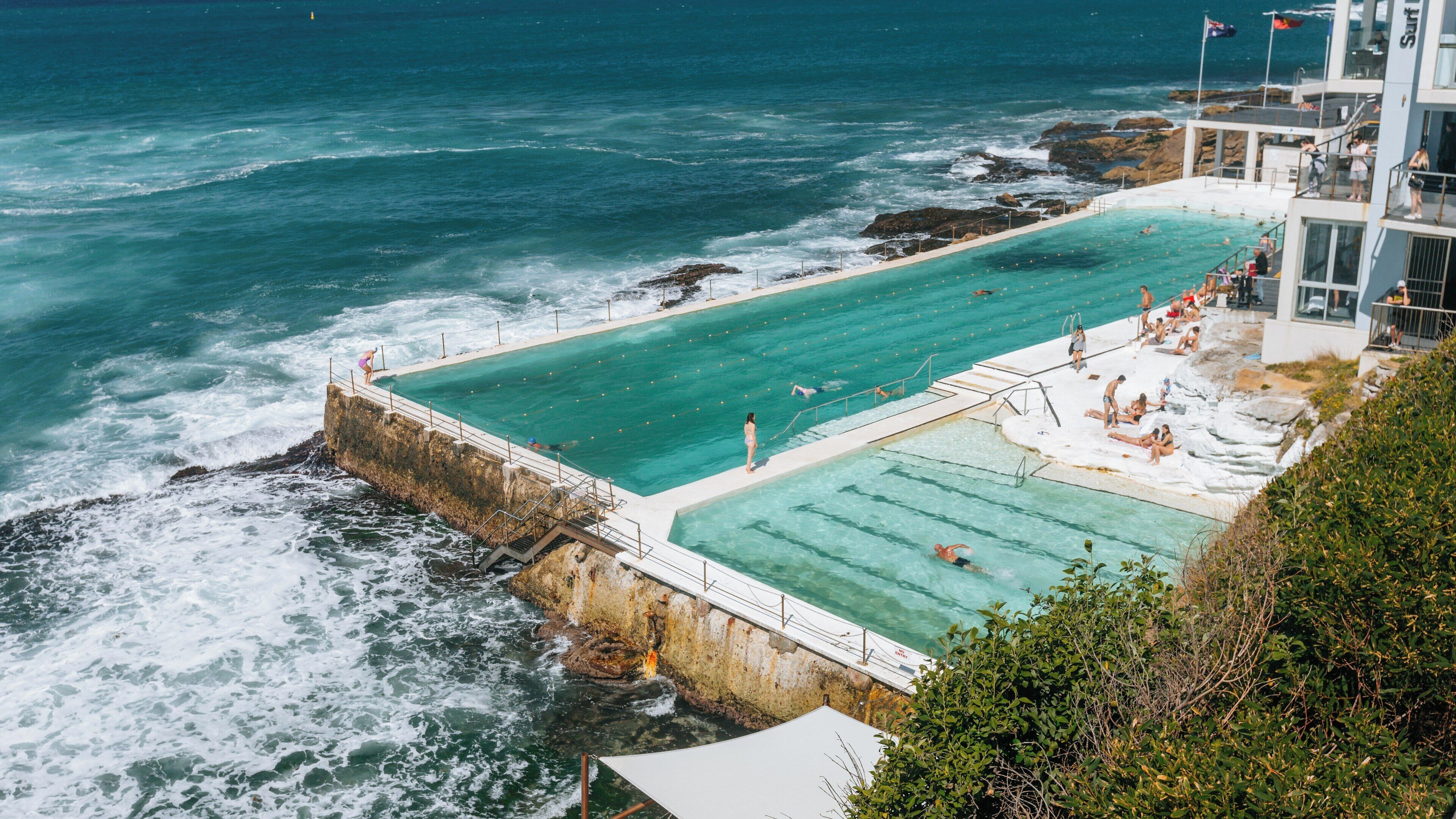 Bondi Beach offers vibrant aquatic activities with stunning views of the ocean and surroundings in Sydney, New South Wales during a sunny day