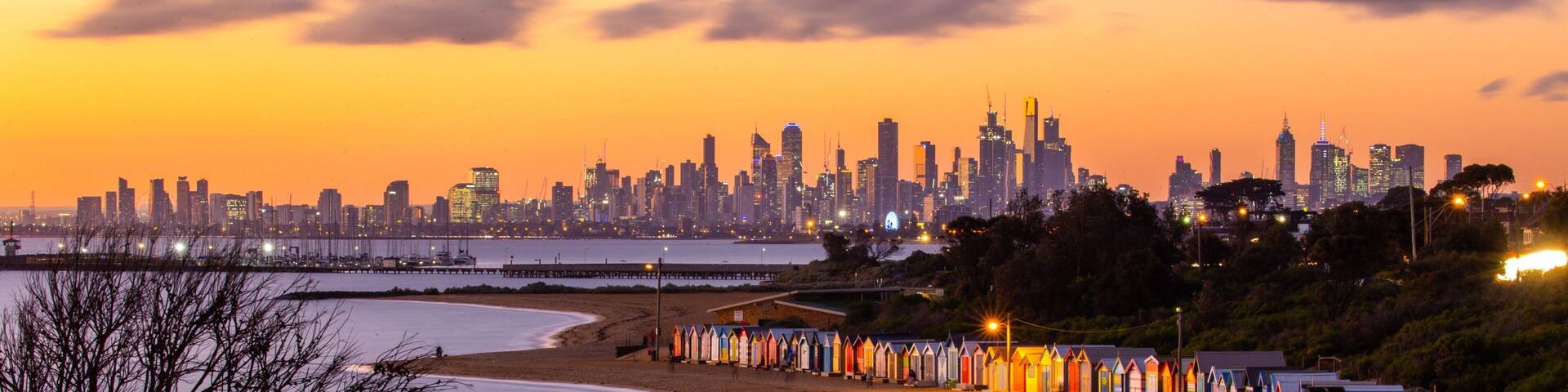 Brighton Beach featuring a city, a sunset and a beach