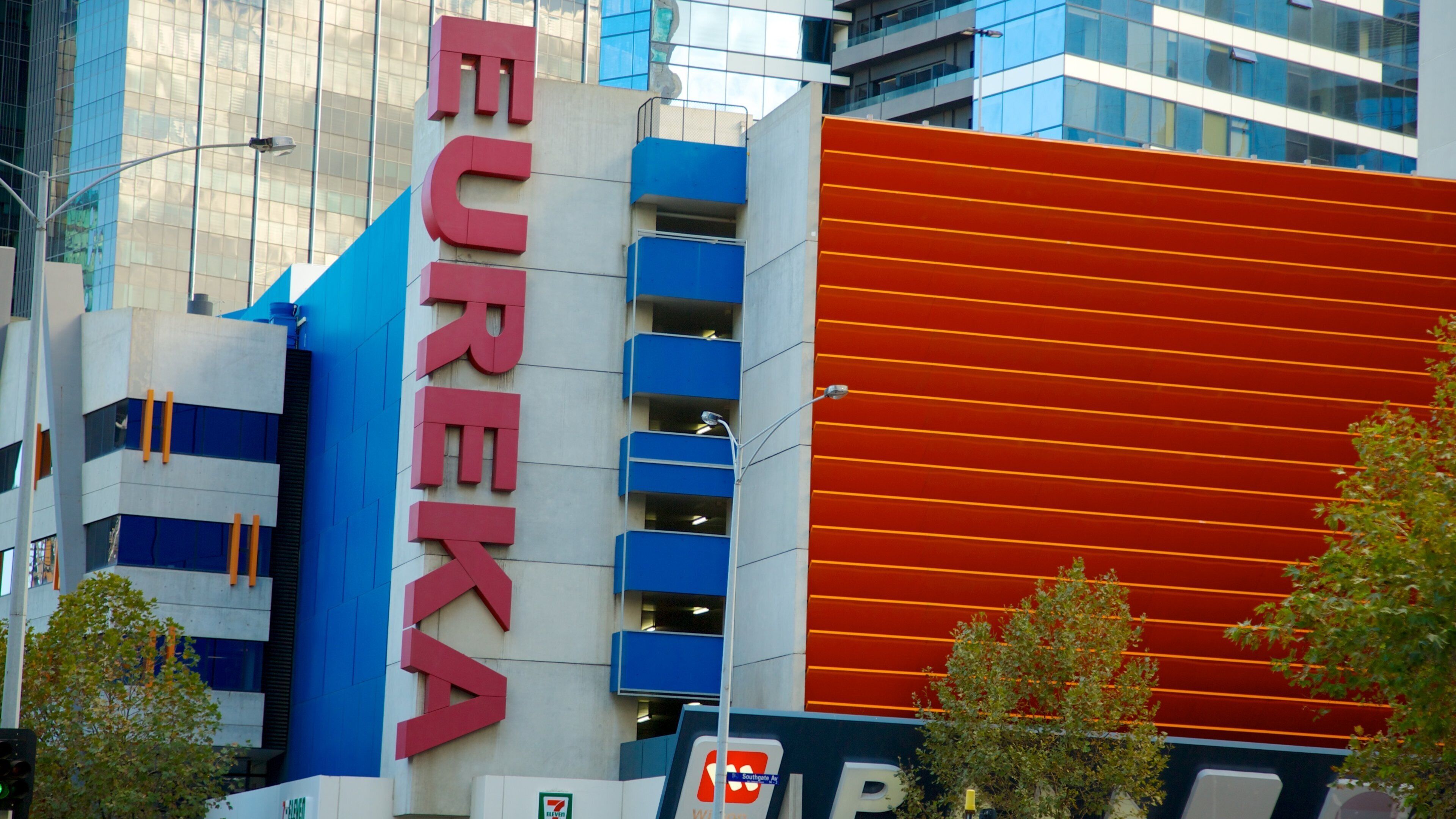 Eureka Tower which includes signage, a city and modern architecture
