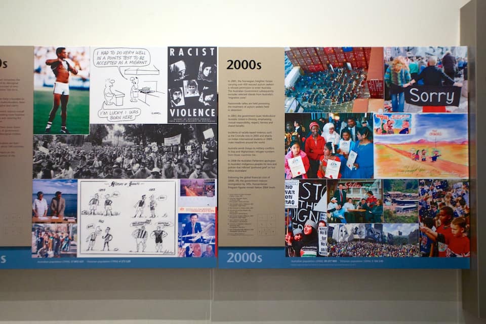 A collage of historical and contemporary images related to immigration in Victoria, including a 'Sorry' sign, a crowd, and a 'No War on Iraq' protest.