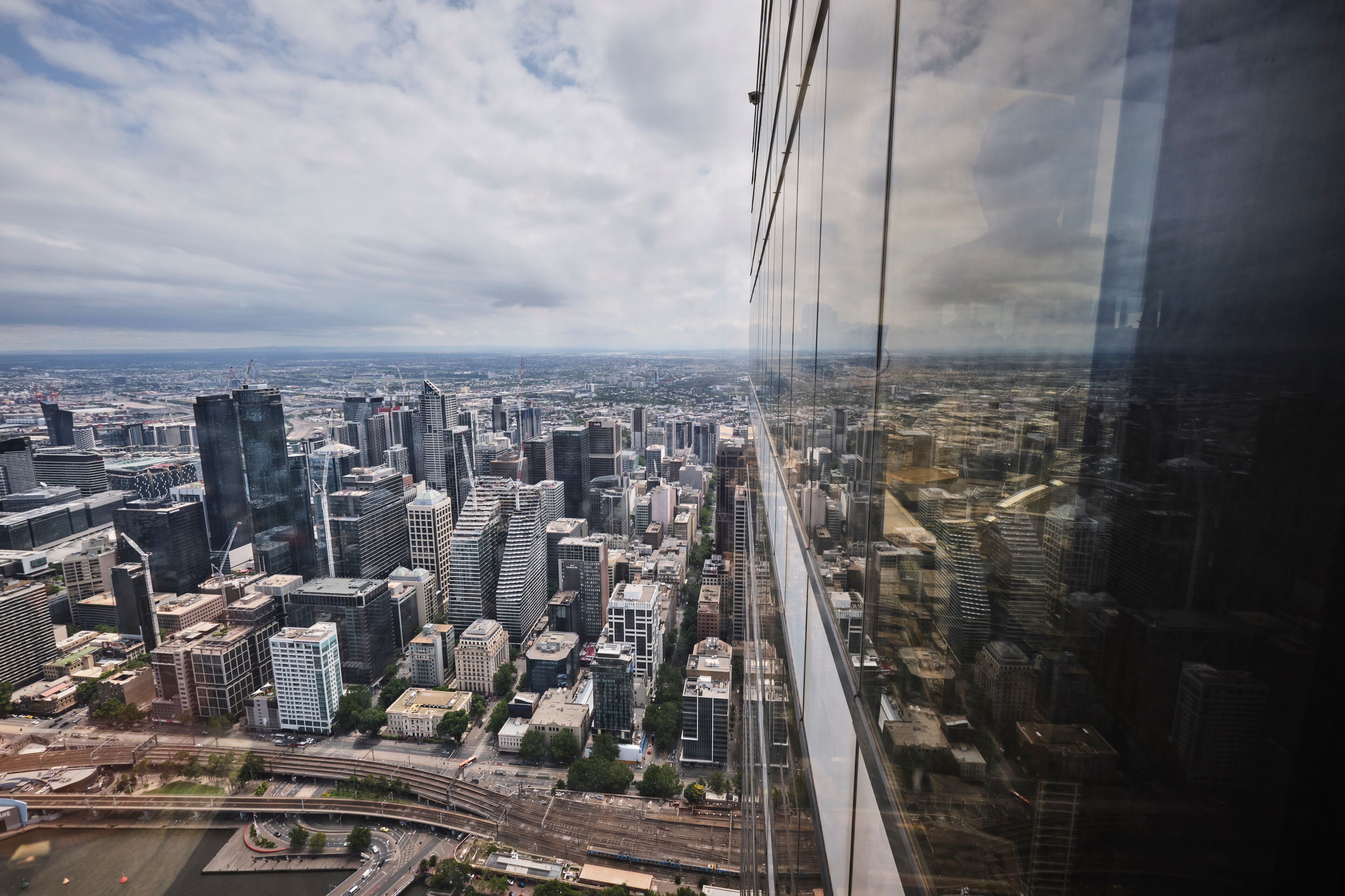 View over Melbourne CBD and skyline from inside viewing platform at skydeck, Melbourne