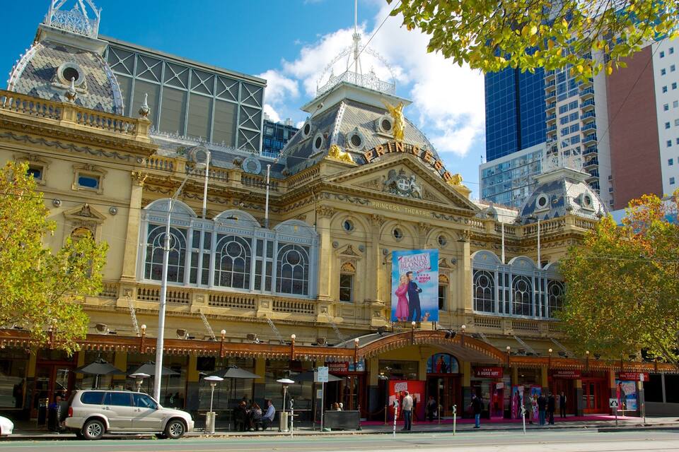 A historic theater with ornate architecture and a large marquee.