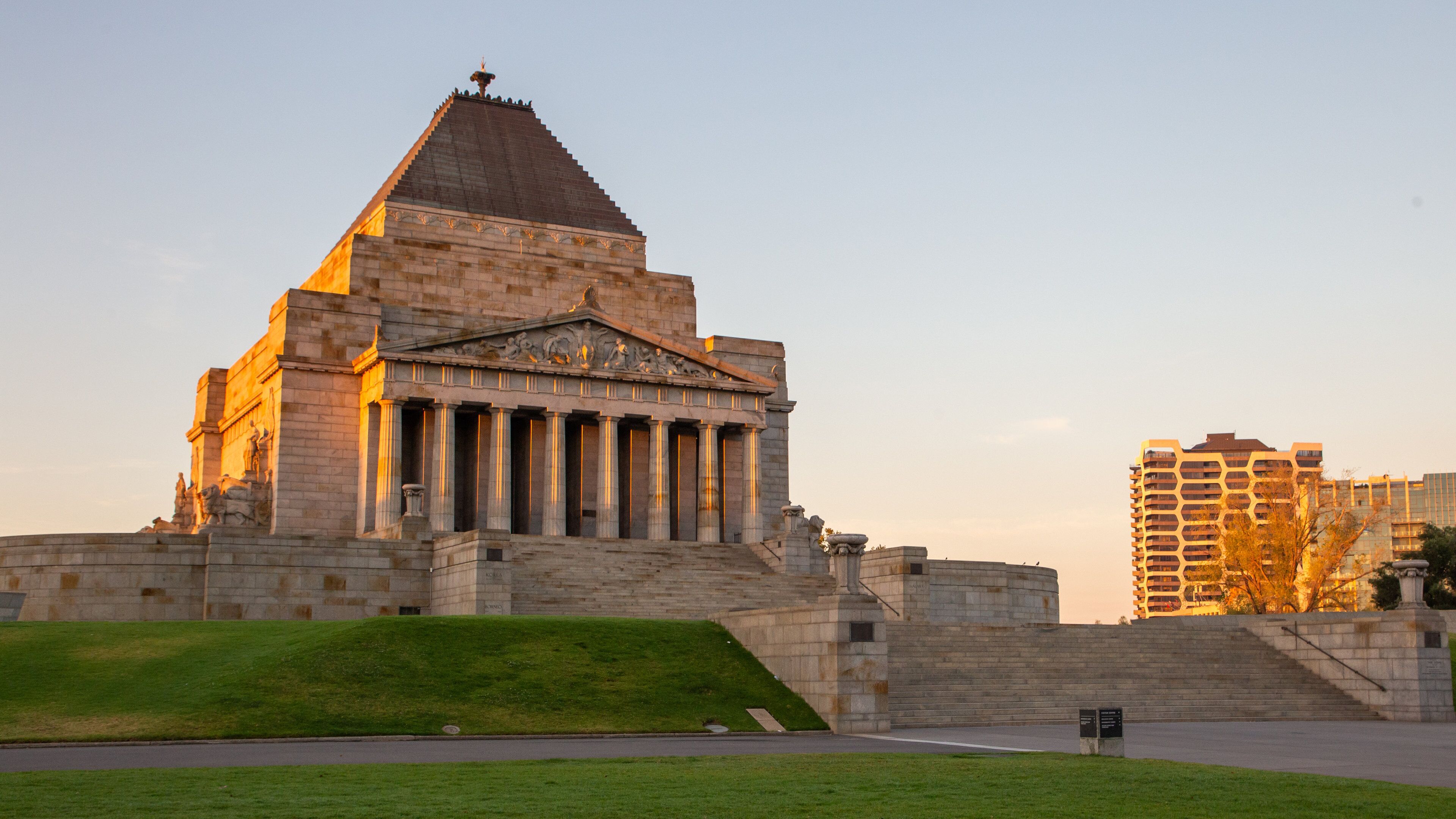 Shrine of Remembrance which includes heritage architecture and a sunset