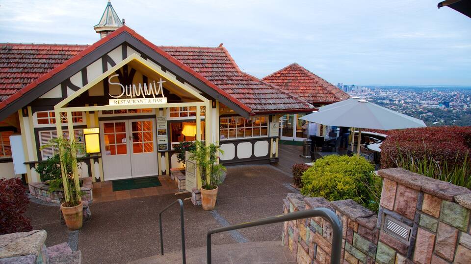 A restaurant named Summit with a red-tiled roof and a view of the city.