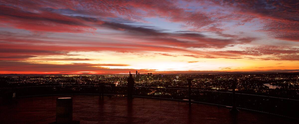 Mt. Coot-Tha which includes night scenes, a sunset and a city