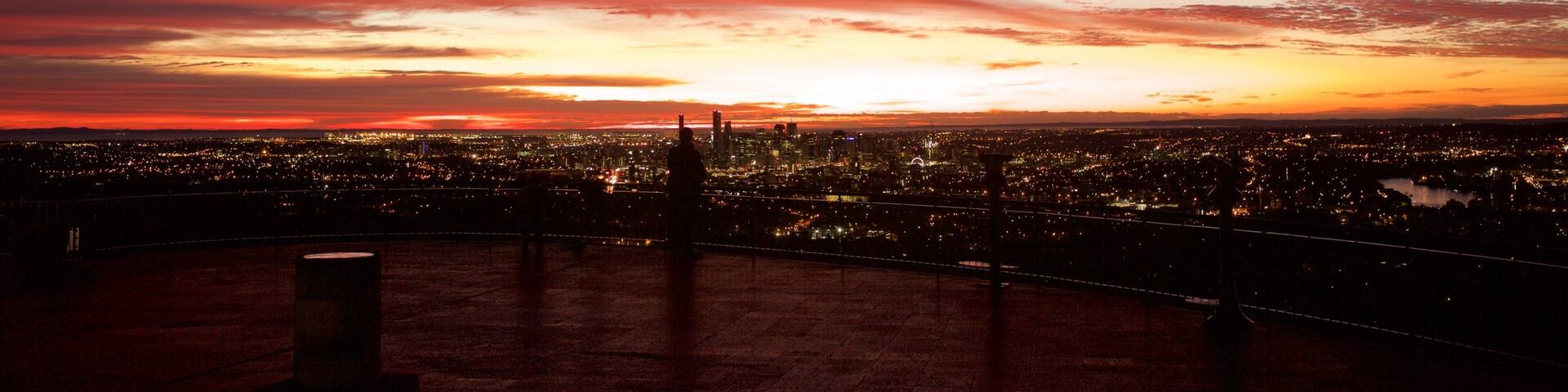 Mt. Coot-Tha showing night scenes, a city and central business district