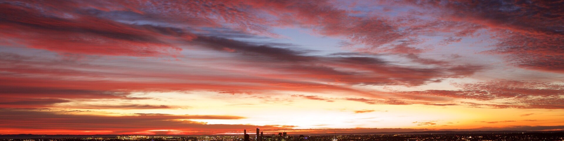 Mt. Coot-Tha showing night scenes, a city and central business district