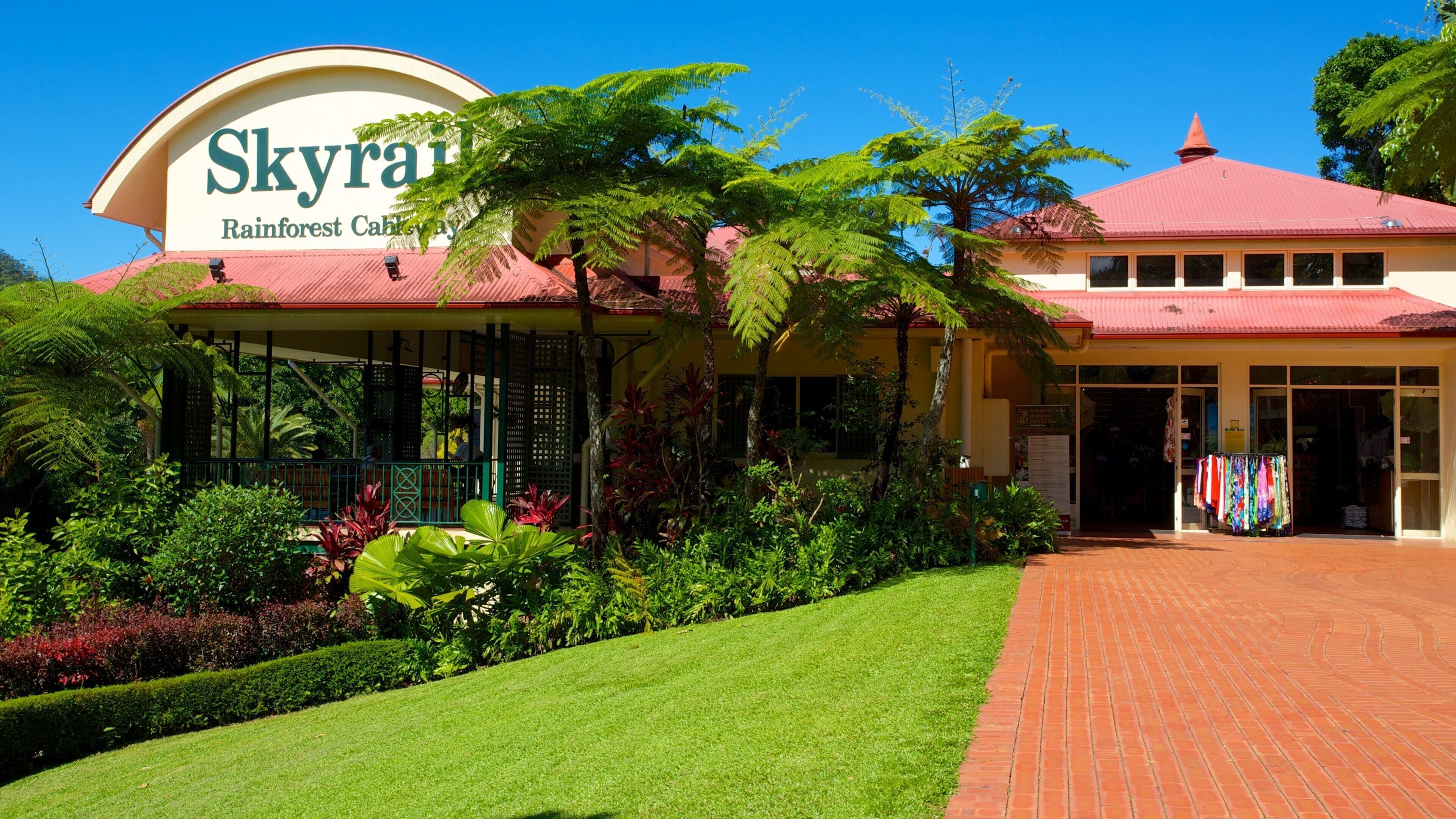 A building with a sign reading "Skyra Rainforest Cabay."