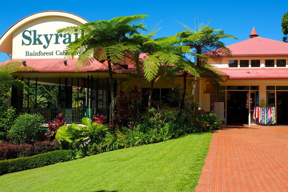 A building with a sign reading "Skyra Rainforest Cabay."