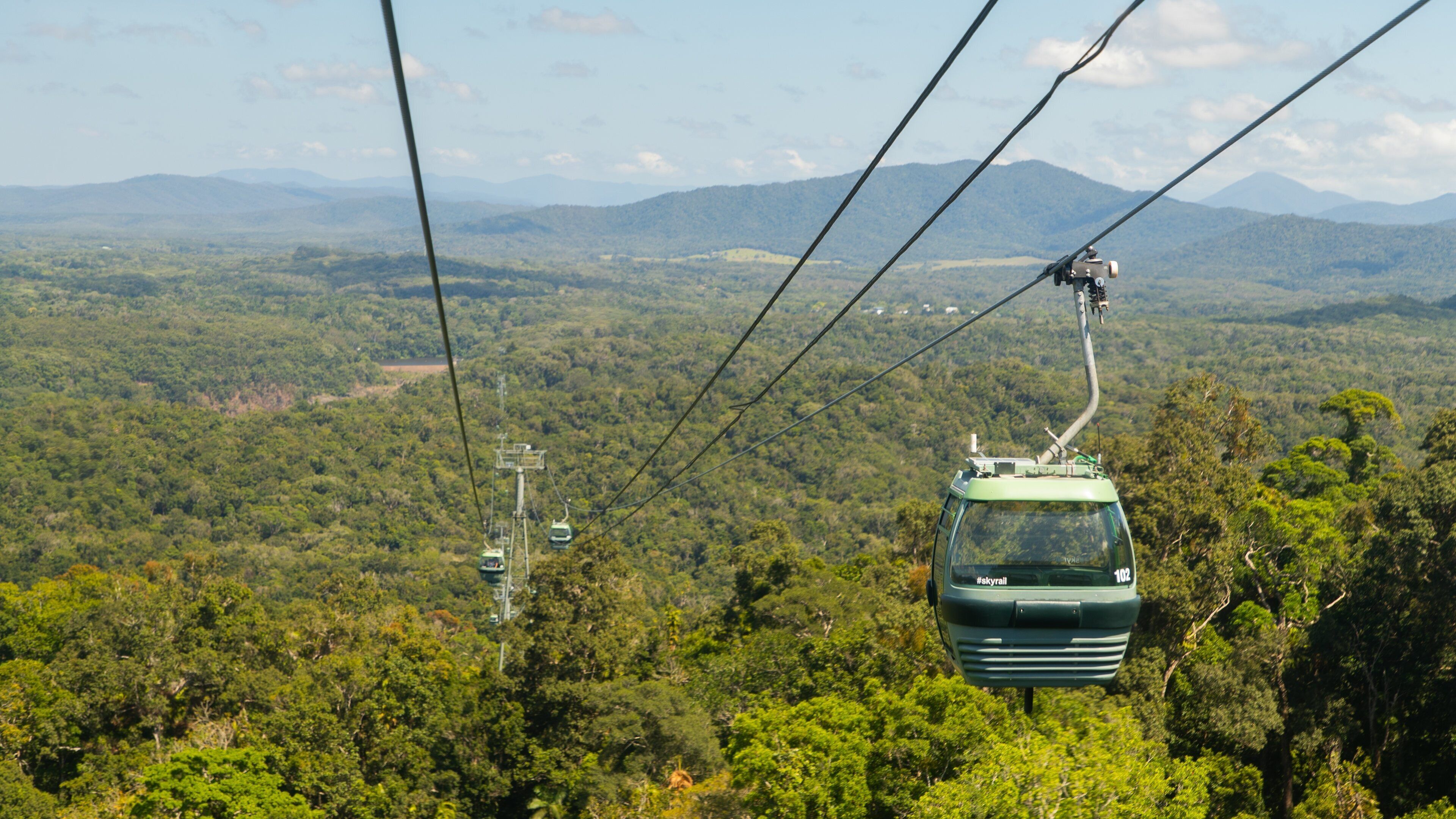 Skyrail Rainforest Cableway featuring landscape views, tranquil scenes and a gondola