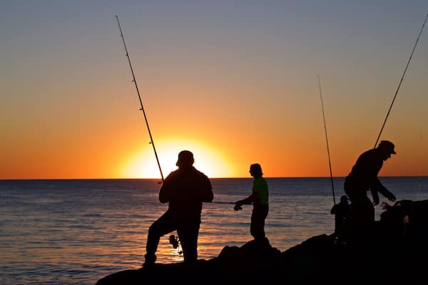 Cottesloe Beach showing rocky coastline, general coastal views and fishing
