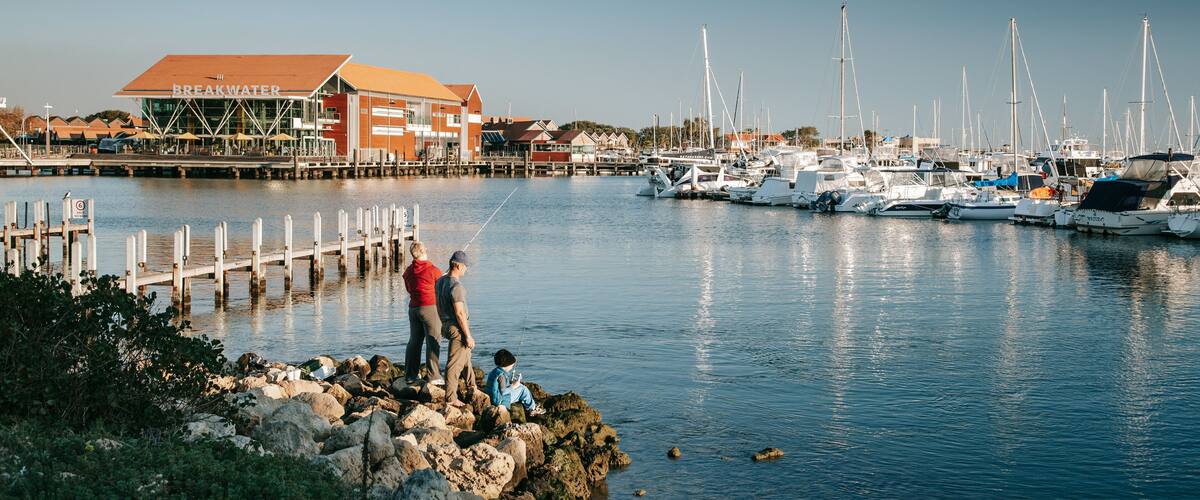 Hillarys Boat Harbour featuring a bay or harbor and fishing as well as a family