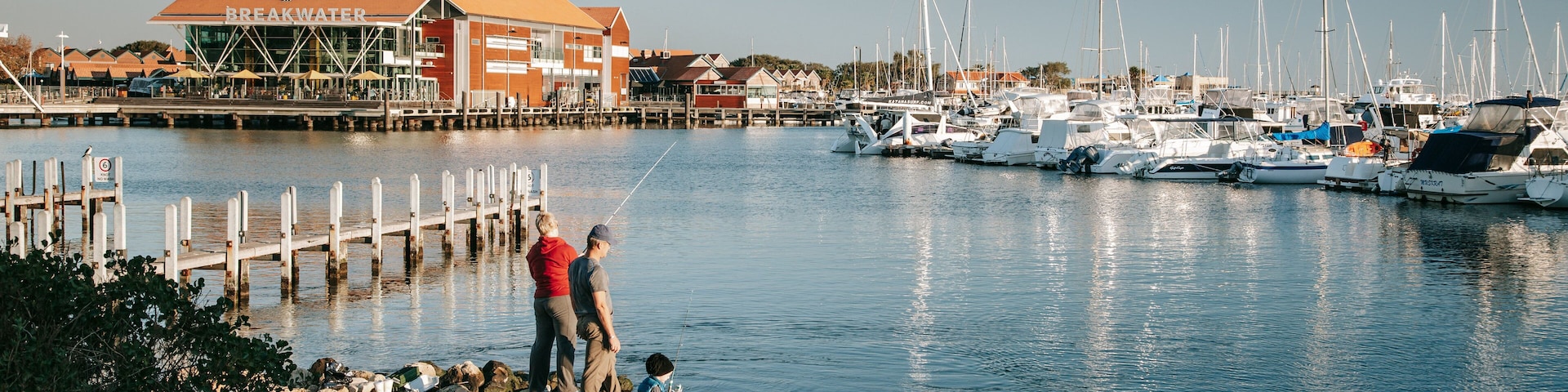 Hillarys Boat Harbour featuring a bay or harbor and fishing as well as a family