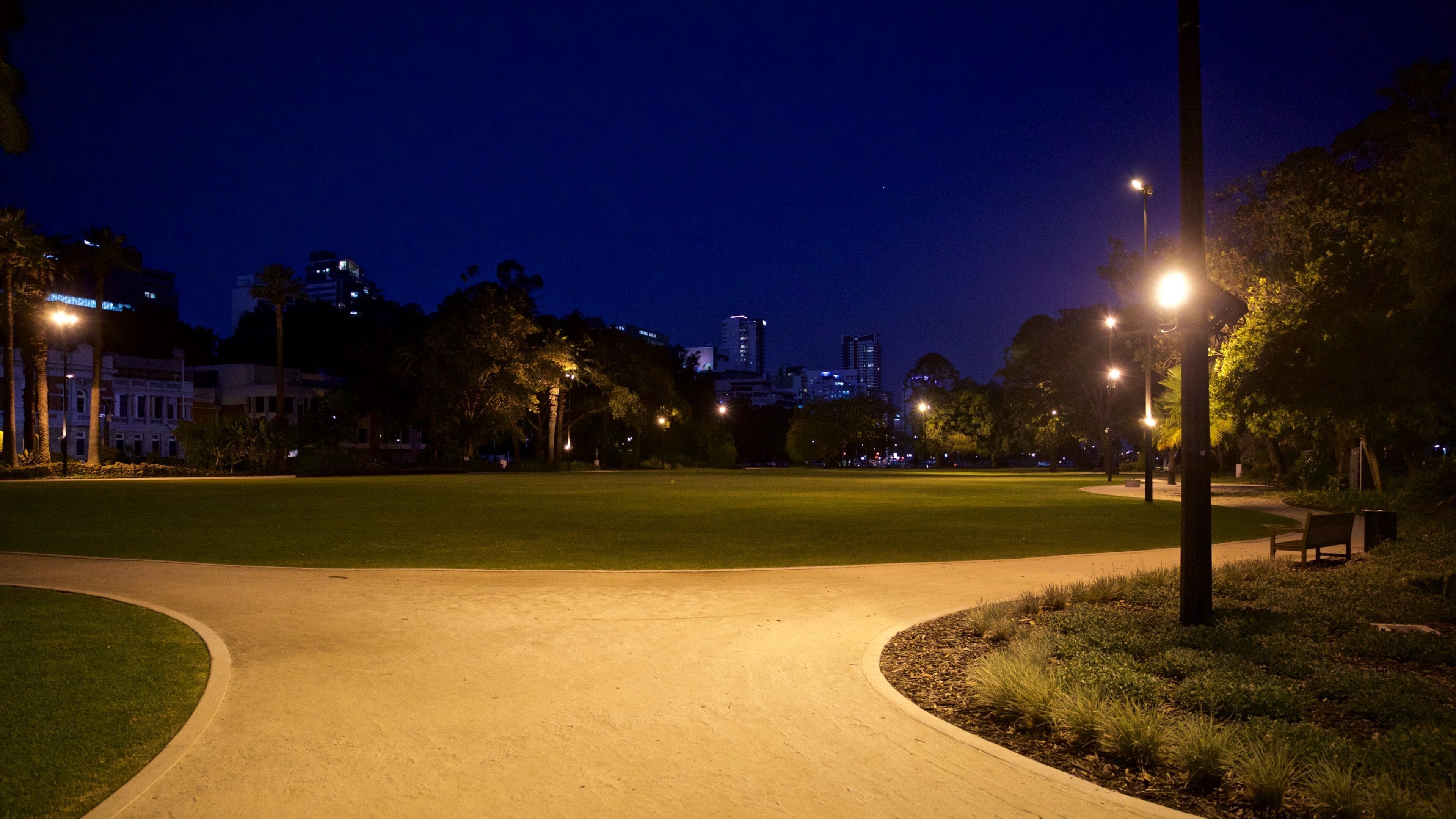 Supreme Court Gardens featuring night scenes and a park