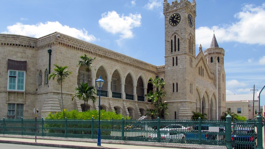 The old historic building is a fortress with a tower and clock. The Parliament Building Of Barbados. Little Big Ben. The capital of Barbados is Bridgetown, Caribbean.