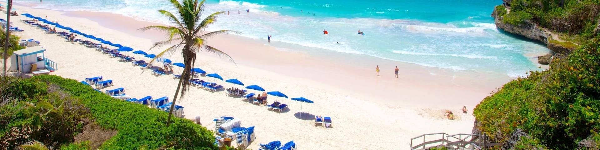 Plage Crane montrant ville cĂŽtiĂšre, plage et scĂšnes tropicales