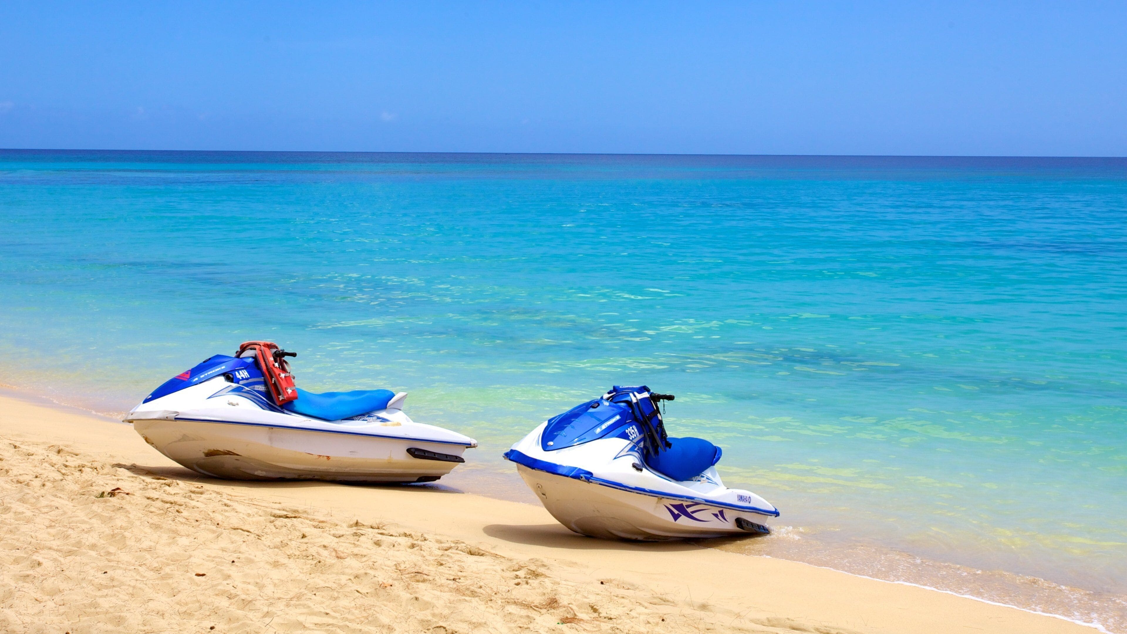 Mullins Beach showing a sandy beach and jet skiing